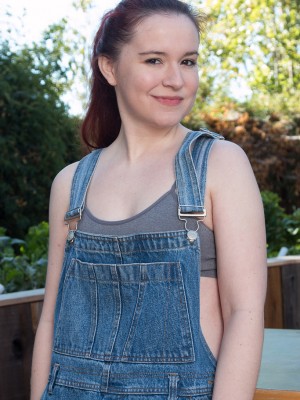 Annabelle Lee takes off the woman overalls and flashes those puffy bra-stuffers